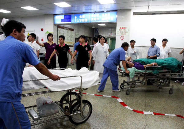 The injured are wheeled to a hospital following a subway train collision in Shanghai, east China, Sept. 27, 2011. A subway train rear-ended another Tuesday afternoon in Shanghai. Over 260 people injur