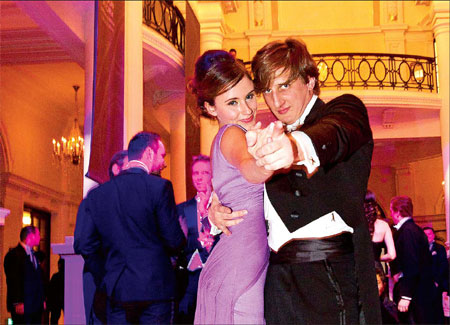 Larissa Scotting, 17, from the UK dances with her escort on Saturday night at the first Shanghai International Debutante Ball. She was named Debutante of the Year. (Photo: Gao Erqiang / China Daily)