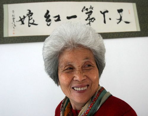 Zhou Shuhua, 80, a resident in Shenyang, is deemed by many, as what reads on the scroll in calligraphy on the wall behind her, China's No 1 Matchmaker. 