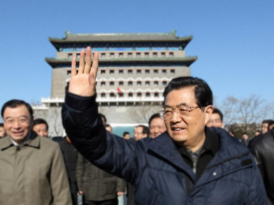 Chinese President Hu Jintao greets the public as he visits the Qianmen shopping street in Beijing, capital of China, Jan. 22, 2012. Hu visited grassroots urban and rural areas in Beijing on Sunday, th