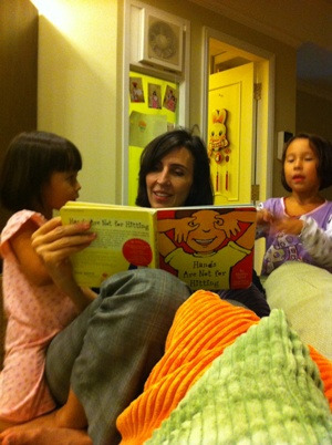 Kim Lee reads to two of her children. Photo: Courtesy of Kim Lee 