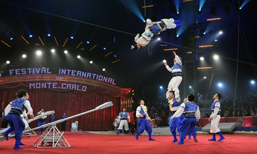 Acrobats from the Shanghai Acrobatic Troupe perform Teng Yue at the 36th International Circus Festival of Monte Carlo..jpeg