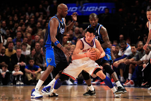 Jeremy Lin of the New York Knicks is guarded by Lamar Odom (L) and Dominique Jones of the Dallas Mavericks at Madison Square Garden in New York City on Sunday, Feb. 19, 2012. Jeremy Lin had 28 points and a career-high 14 assists, Steve Novak made four 3-p