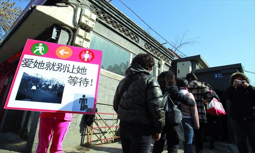 Scenes from the occupation. The sign reads Don't let her wait if you love her! [Photo: IC]