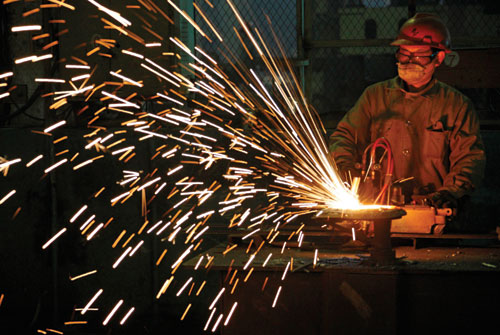 A worker at an equipment-manufacturing factory in Huaibei city, Anhui province. Inland provinces are expected to provide new impetus for China's growth as global demand slows.[Photo/China Daily]