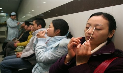 Patients wait for treatment at the ophthalmology department of a hospital. Photo: CFP