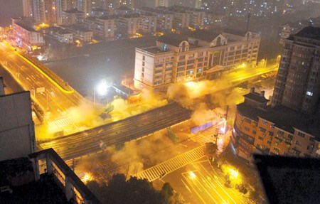 After being in operation for 16 years, a 724-meter viaduct was demolished in Nanjing, capital of East China's Jiangsu province, on Saturday night. Zhao Jie / for China Daily