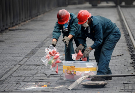 Workers incinerate drugs and precursor chemicals confiscated by police in a furnace at a chemical plant in Kunming, Southwest China's Yunnan province, last year. More than two metric tons of drugs and precursor chemicals were destroyed that day. Lin Yiguang / Xinhua 