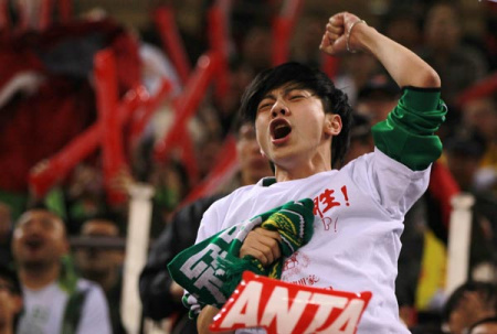 A Beijing fan cheers for the host team during Game 4 of the CBA Finals between the Beijing Ducks and the Guangdong Southern Tigers at the MasterCard Center in Beijing, March 28, 2012.