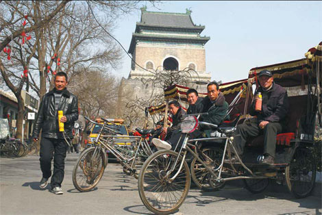 Rickshaw drivers wait for customers.