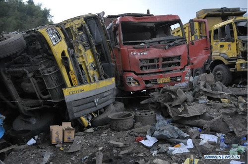 A building collapse triggered by an explosion in a nearby garage killed nine and injured 36 others Sunday morning. The accident happened at 10:35 a.m., when the explosion ripping through the garage toppled down a four-story building in Daji Village, Longy