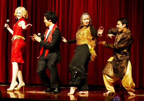 An Indian dance performed by Indian student Harshit Tailor (right) creates a sensation on stage during a talent show for foreign students at the University of International Business and Economics in Beijing. [Photo by Zhu Xingxin / China Daily]