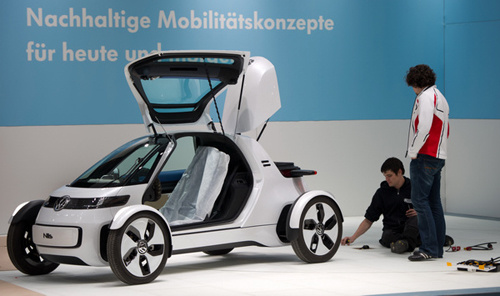 A Volkswagen battery-powered car is assembled on Friday in Hannover, Germany, ahead of the city's major technology fair. Jochen Luebke / Agence France-Presse 