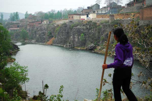 The Qihe River is the sole source of drinking water for Dangjie village, in Linzhou, Henan province. Villagers said the river has been polluted in recent years by businesses upstream. XIANG MINGCHAO / CHINA DAILY 