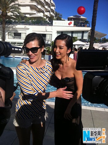 Milla Jovovich and Li Bingbing Reunite at Cannes. [Xinhua]