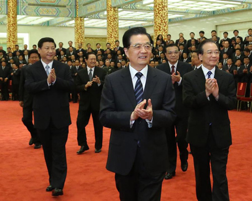 Chinese President Hu Jintao (C, front) and other top leaders, including Wen Jiabao, Xi Jinping, Li Keqiang and Zhou Yongkang, meet with participants of the third national work conference on pairing assistance projects to support Xinjiang development at the Great Hall of the People in Beijing, capital of China, May 30, 2012. (Xinhua/Lan Hongguang)