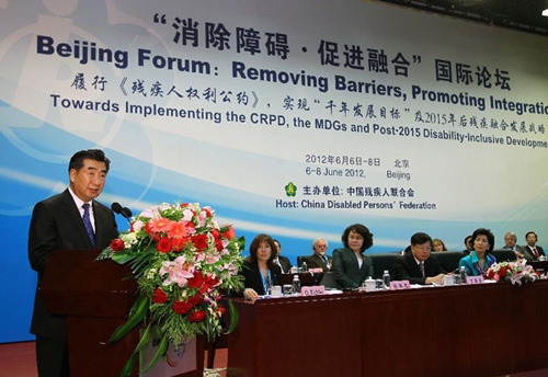 Chinese Vice Premier Hui Liangyu (1st L) addresses the opening ceremony of an international forum titled Removing Barriers, Promoting Integration in Beijing, capital of China, June 6, 2012. (Xinhua/Fan Rujun)