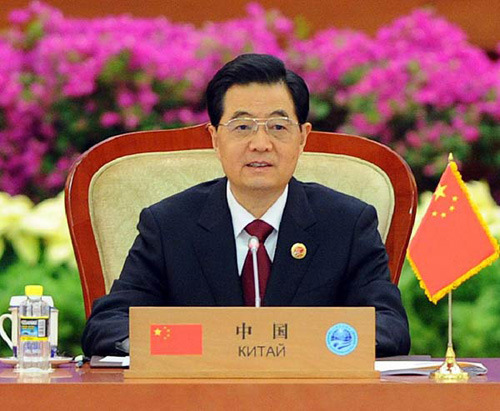 Chinese President Hu Jintao presides over the large group meeting of the 12th Meeting of the Council of Heads of Member States of the Shanghai Cooperation Organization (SCO) at the Great Hall of the People in downtown Beijing, capital of China, June 7, 20