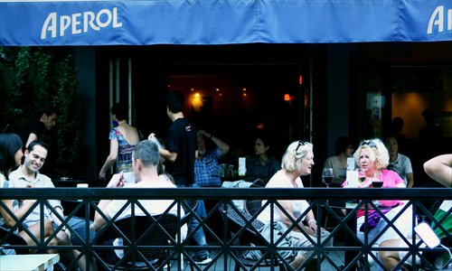 Customers drink at Aperitivo in Sanlitun Sunday.