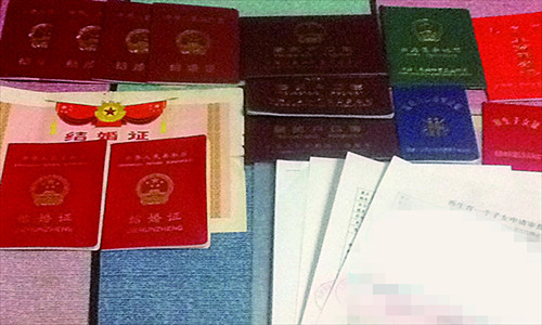 Dozens of certificates and forms with more than 30 stamps are needed to apply for the birth permit of Wang Mei's second child. Photo: Courtesy of Wang Mei 