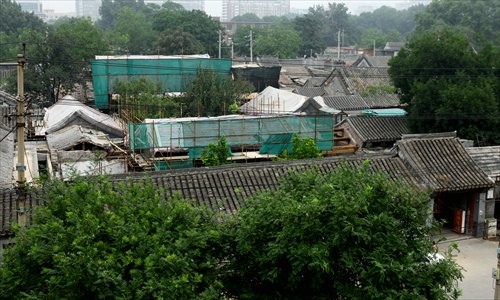 The illegal construction project at a courtyard at No.51 Shijia Hutong, the former residence of a famous Chinese politician, is stopped Sunday. [Photo: Guo Yingguang/GT]