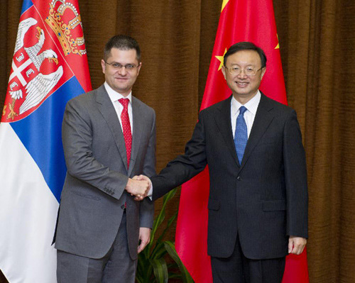 Chinese Foreign Minister Yang Jiechi (R) shakes hands with Vuk Jeremic, the president-elect of the 67th session of the UN General Assembly and Serbian Foreign Minister, in Beijing, capital of China, July 16, 2012. (Xinhua/Wang Ye)