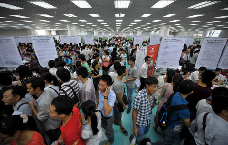 Job seekers attend a job fair in Haikou, South China's Hainan, Aug 2, 2012. 