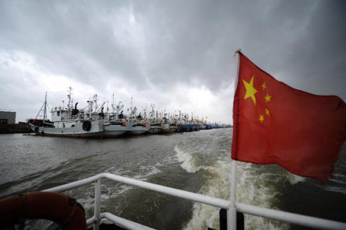 Fishing boats are moored at the port in Jinqing Town of Taizhou City, east China's Zhejiang Province, Aug. 7, 2012. Typhoon Haikui is expected to land in the coastal areas of north-central Zhejiang late Aug. 7 or early Aug. 8.