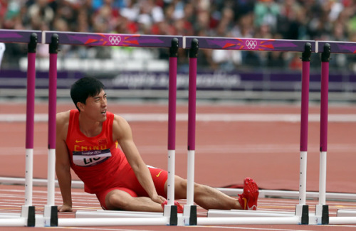 Liu Xiang crashes into the first barrier in the opening heat of the 110m hurdles in London on Tuesday. In a poignant and brave gesture Liu picks himself up, and despite being injured, hops to the last hurdle and kisses it. To the roar of the crowd Liu then embraces his waiting rivals who help him from the track.