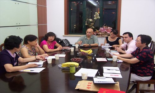 Carlos Candeias (second from right) at a meeting of the Yanlord Gardens Neighborhood Committee Photo: Courtesy of the committee 