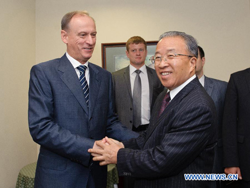 Chinese State Councilor Dai Bingguo (R) shakes hands with Nikolai Patrushev, the Secretary of the Russian Security Council, during the seventh round of strategic security talks between China and Russia in Moscow, capital of Russia, Aug. 20, 2012.(Xinhua/Jiang Kehong)