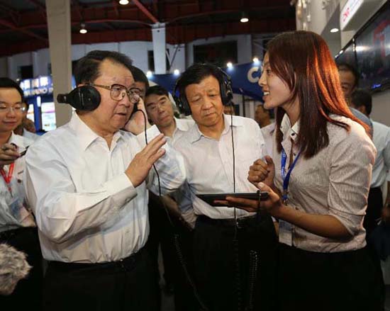 Li Changchun (L, Front), a member of the Standing Committee of the Political Bureau of the Communist Party of China (CPC) Central Committee, visits the 2012 Beijing International Radio, TV & Film Equipment Exhibition (BIRTV) in Beijing, capital of China, 