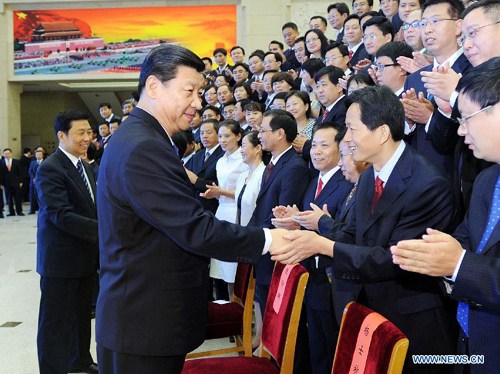 Chinese Vice President Xi Jinping (1st L) meets with attendees of a concluding meeting for a campaign to improve morality in the country's organization system in Beijing, capital of China, Aug. 29, 2012. (Xinhua/Li Tao)