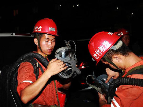 Rescue team members from Dazhou City, southwest China's Sichuan Province, prepare to carry out rescue operation at the Xiaojiawan Coal Mine in Panzhihua City, southwest China's Sichuan Province, on Aug. 30, 2012.  (Xinhua/Deng Liangkui)