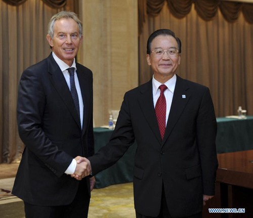 Chinese Premier Wen Jiabao (R) shakes hands with former British Prime Minister Tony Blair during a meeting with him in Urumqi, northwest China's Xinjiang Uygur Autonomous Region, Sept. 2, 2012. (Xinhua/Zhang Duo) 