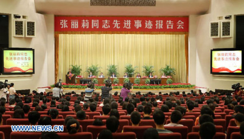 A seminar on Zhang Lili's story is held at the Great Hall of the People in Beijing, China, Sept. 4, 2012. On May 8, Zhang saved two students from an onrushing bus in northeast China's Heilongjiang province. The 29-year-old teacher at the No. 19 Middle School in the city of Jiamusi, was crossing a road outside the school's main gate when she saw the two students standing in the way of the bus. She successfully pushed the students out of harm's way, but was unable to avoid the bus herself and lost her legs in the accident. (Xinhua/Yao Dawei)