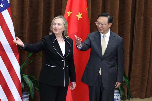 Foreign Minister Yang Jiechi shows the way forward with US Secretary of State Hillary Clinton in Beijing on Tuesday. Feng Yongbin / China Daily 