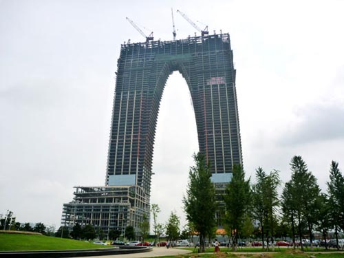 The Gate of the Orient, a landmark building under construction in Suzhou, has drawn criticism over its appearance as a pair of long underwear. Li Gen / for China Daily