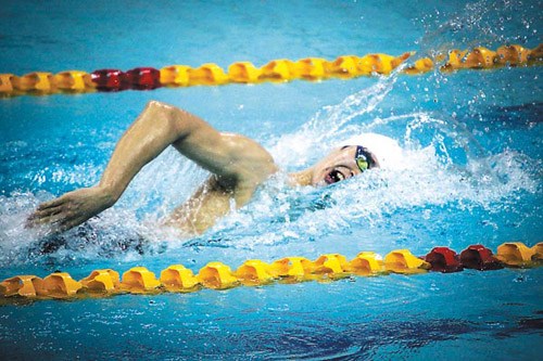 Sun Yang, representing Zhejiang University, swims the first round of the men's 200m freestyle at the University Games of China in Tianjin on Wednesday. Li Xiang / For China Daily