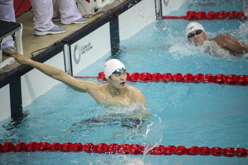 Sun Yang reacts after winning a gold medal at the 200m freestyle at the 9th University Games of China in Tianjin, on Sept 12, 2012. [Photo/Xinhua]