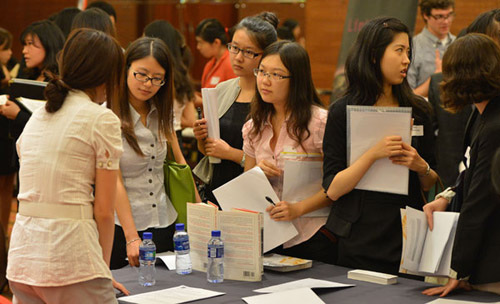 University graduates and other job seekers attend a job fair in Beijing on Sept 3. PROVIDED TO CHINA DAILY