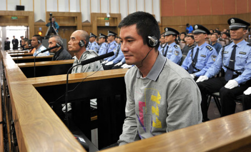 Naw Kham and fi ve other suspects, charged with the murders of 13 Chinese sailors, appear in court in Kunming, Yunnan province, on Thursday.ZHANG HAOLIN / FOR CHINA DAILY