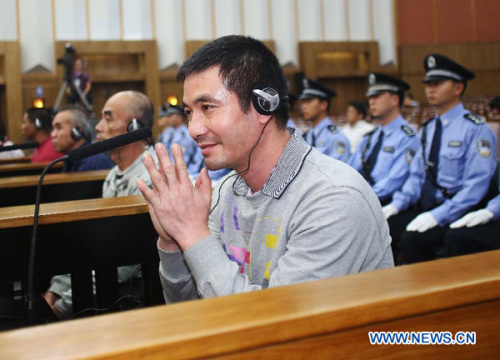 Naw Kham is seen at the Intermediate People's Court of Kunming, capital of Yunnan Province, Sept. 21, 2012. Naw Kham, principal suspect for the murders of 13 Chinese sailors on the Mekong River last year, pleaded guilty Friday evening when he and five other people were standing trial in southwest China. (Xinhua/Wang Shen)