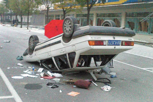 A car is seen turned upside down on Monday in the Foxconn plant in Taiyuan after rioting.WEI LIANG / CHINA NEWS SERVICE