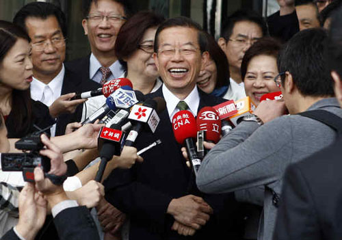 Frank Hsieh, a senior member of Taiwan's opposition Democratic Progressive Party, answers questions from media as he leaves his hotel in Beijing before returning to Taiwan on Monday. Zhang Hao / China News Service