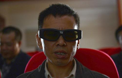 People with visual disabilities watch a film in the special cinema in Chengdu, Sichuan province, on Oct 16, 2012. [Photo/Asianewsphoto]