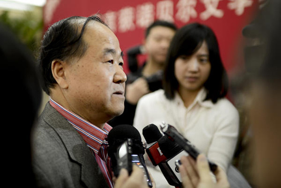 Noble laureate in literature Mo Yan takes questions from reporters in Beijing on Thursday. The writer made his first appearance in Beijing after he won the prize and gave a speech at a seminar held by the Chinese Academy of Arts on Thursday. Liao Pan / China News Service