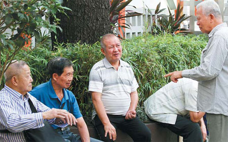 Elderly men chat at a park in Wan Chai, Hong Kong. Er Qizheng / China Daily