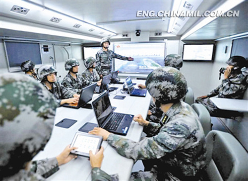 The picture shows the commanding officers of a troop unit under the Nanjing Military Area Command (MAC) are receiving trainings in a field command shelter combining functions of information and intelligence processing, message transmission, video surveillance and control and command on October 24, 2012. (Photo by Mu Ruilin)