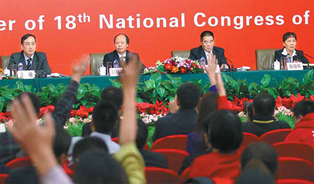 From left, four grassroots delegates to the Party Congress, Wang Xi, Ju Xiaolin, Ting Bateer and Yang Ruihui, address a news conference on Monday. Zou Hong / China Daily 